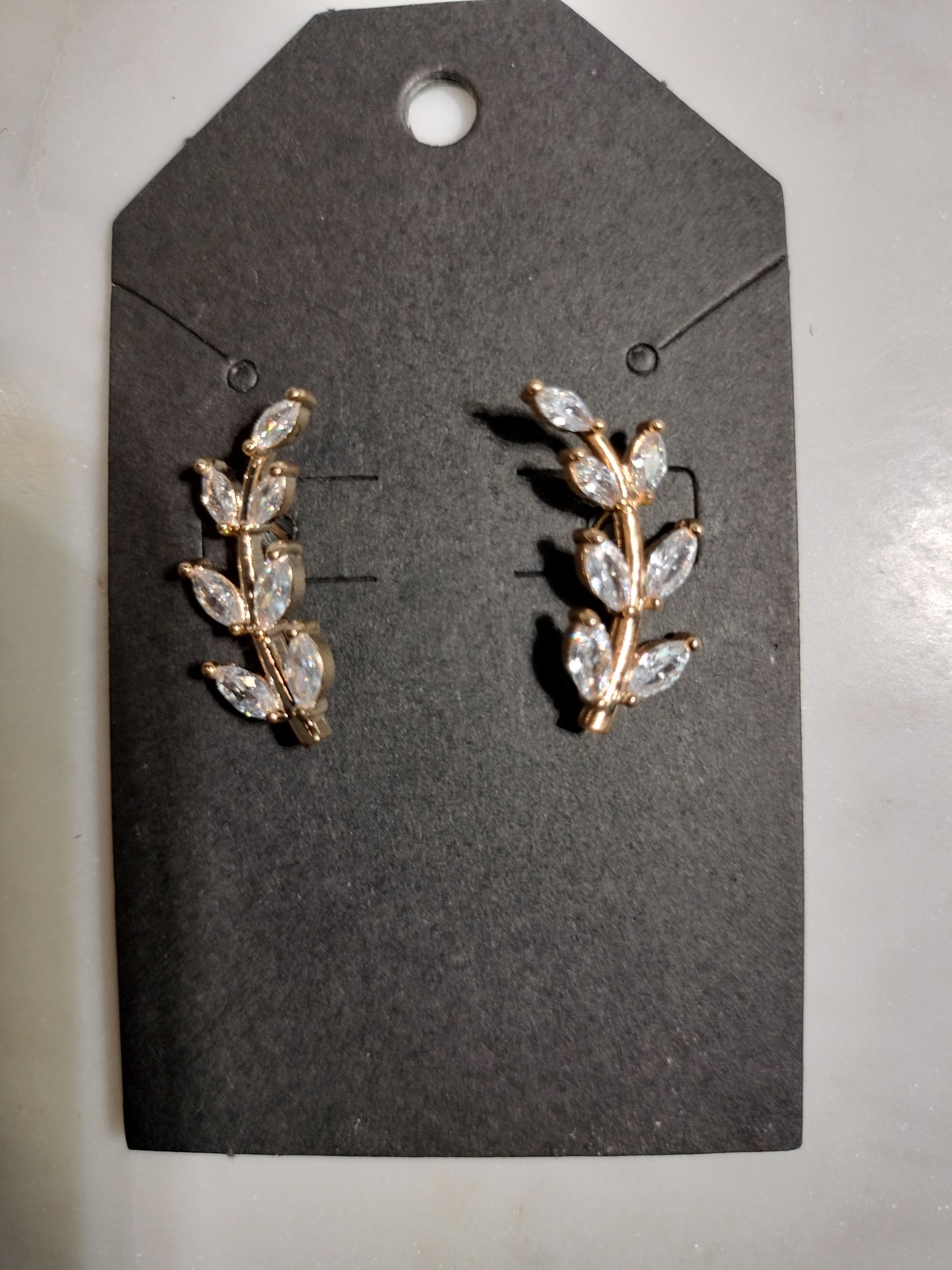 Cubic zirconia budding leaves earrings 14 karat gold plated