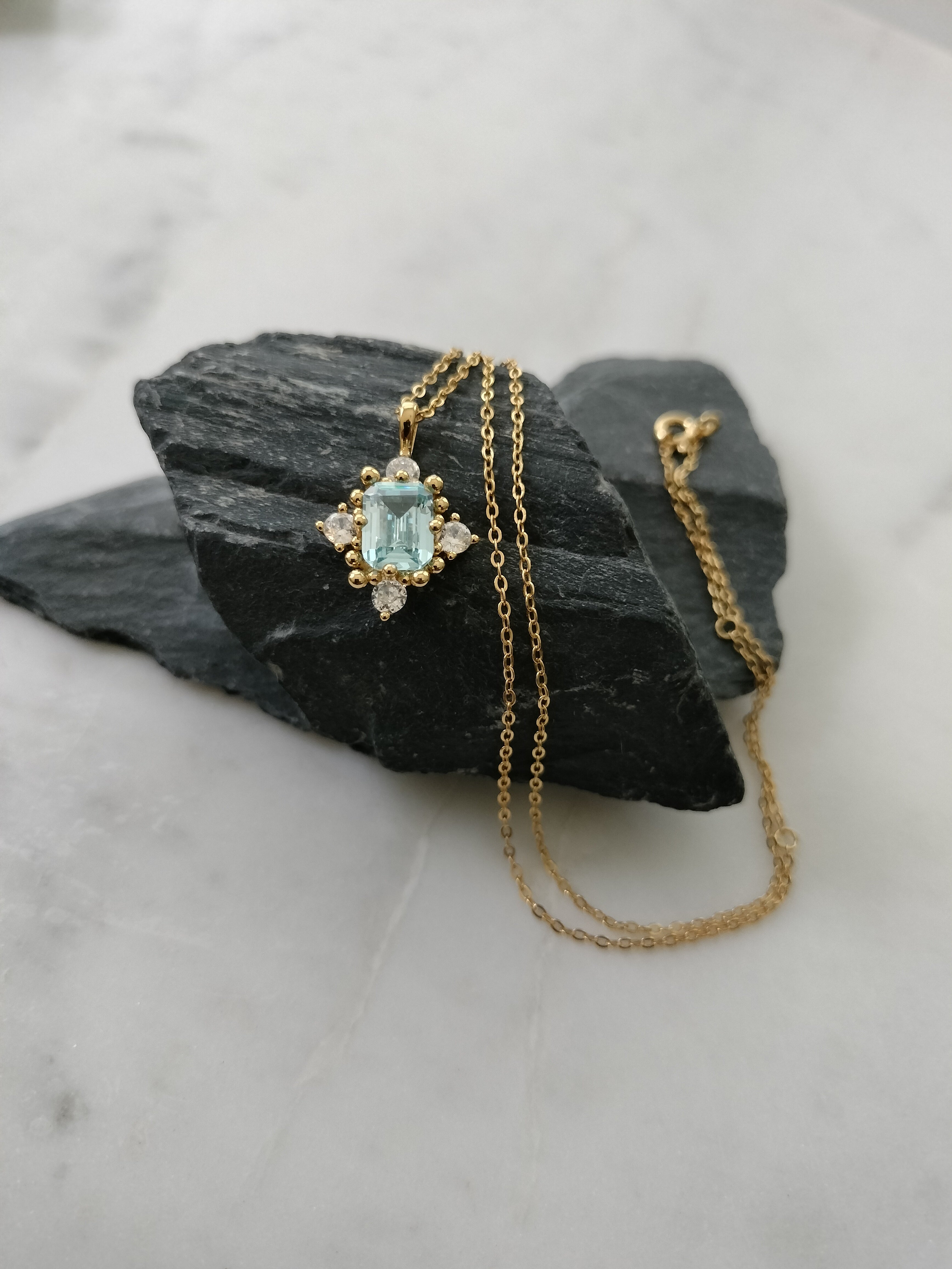 925 Sterling Silver 18k gold plated princess necklace with blue and white zirconia.