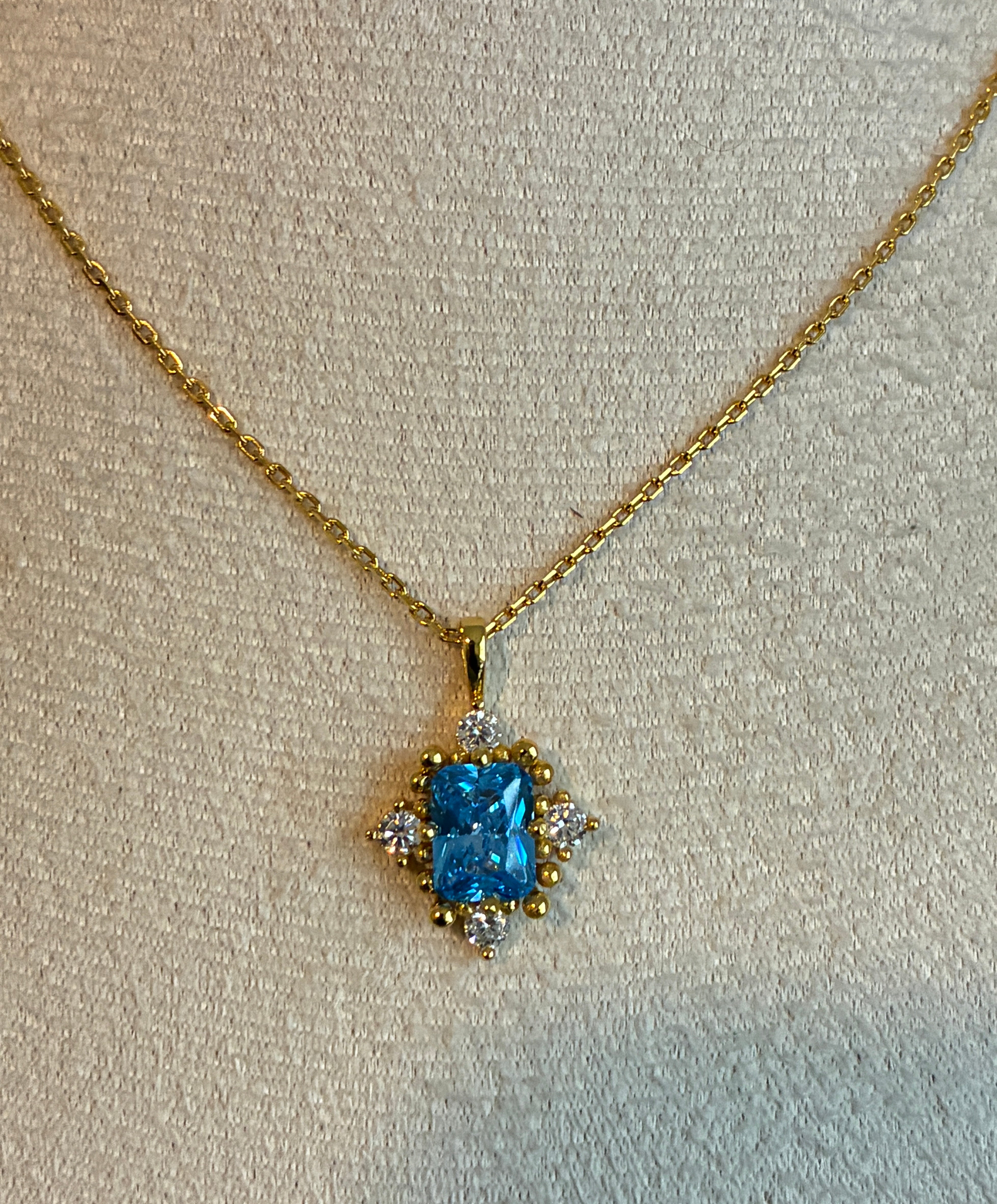 925 Sterling Silver 18k gold plated princess necklace with blue and white zirconia.