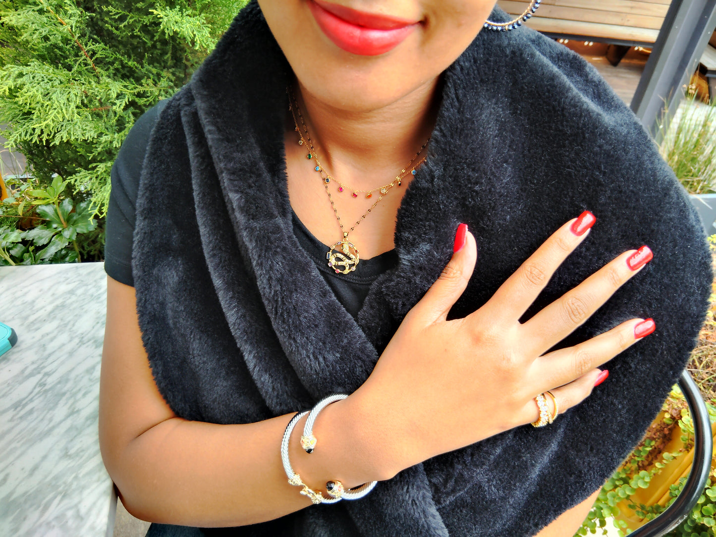 Multicolored snake pendant necklace. 18K triple gold plated stainless steel.18 inches long.