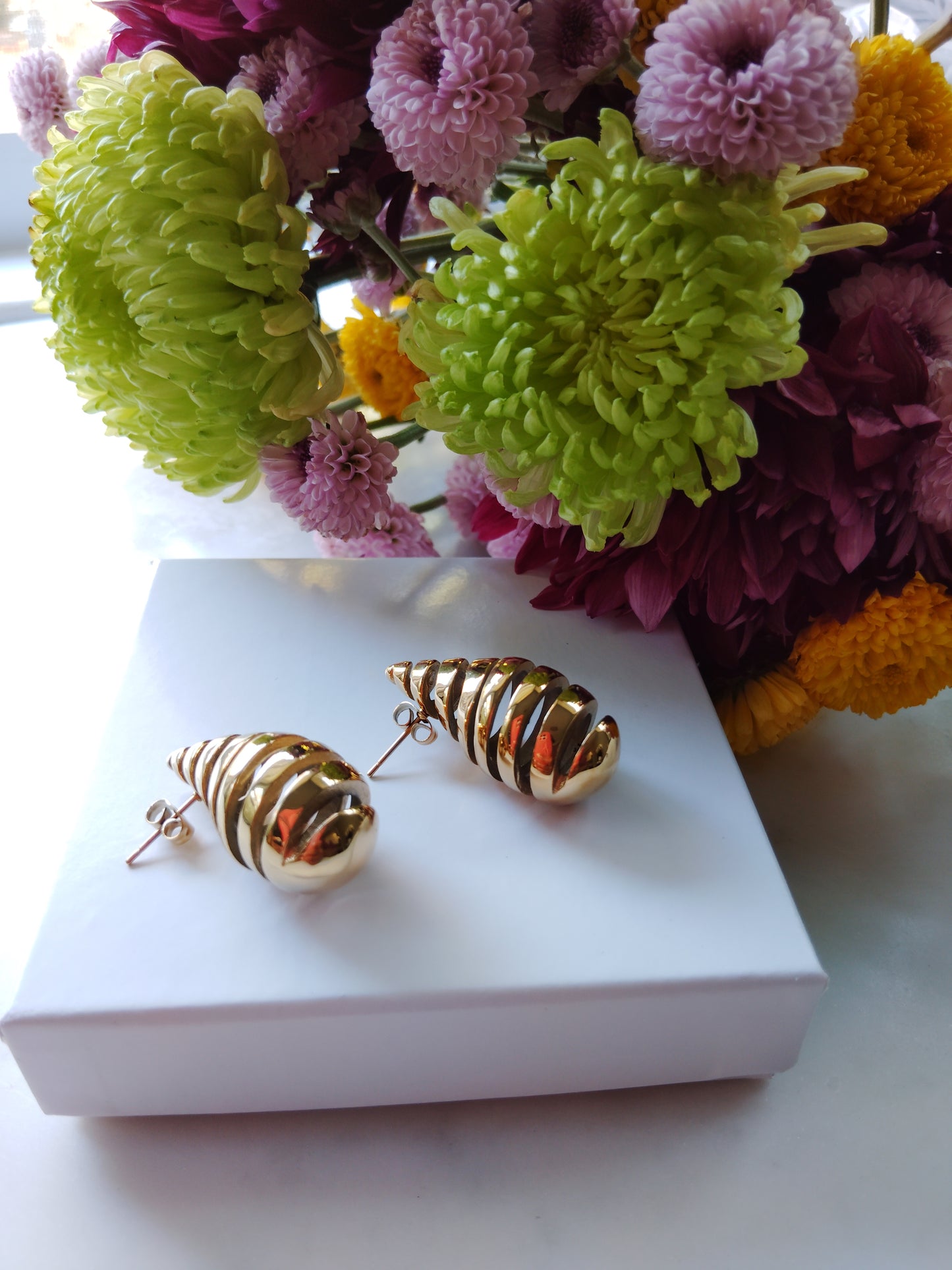 Spiral tear drop earrings 18k triple gold Plated stainless steel .