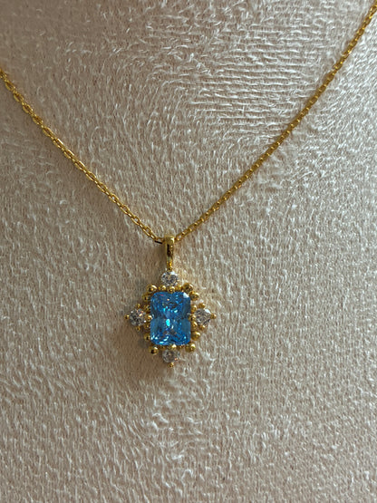 925 Sterling Silver 18k gold plated princess necklace with blue and white zirconia.