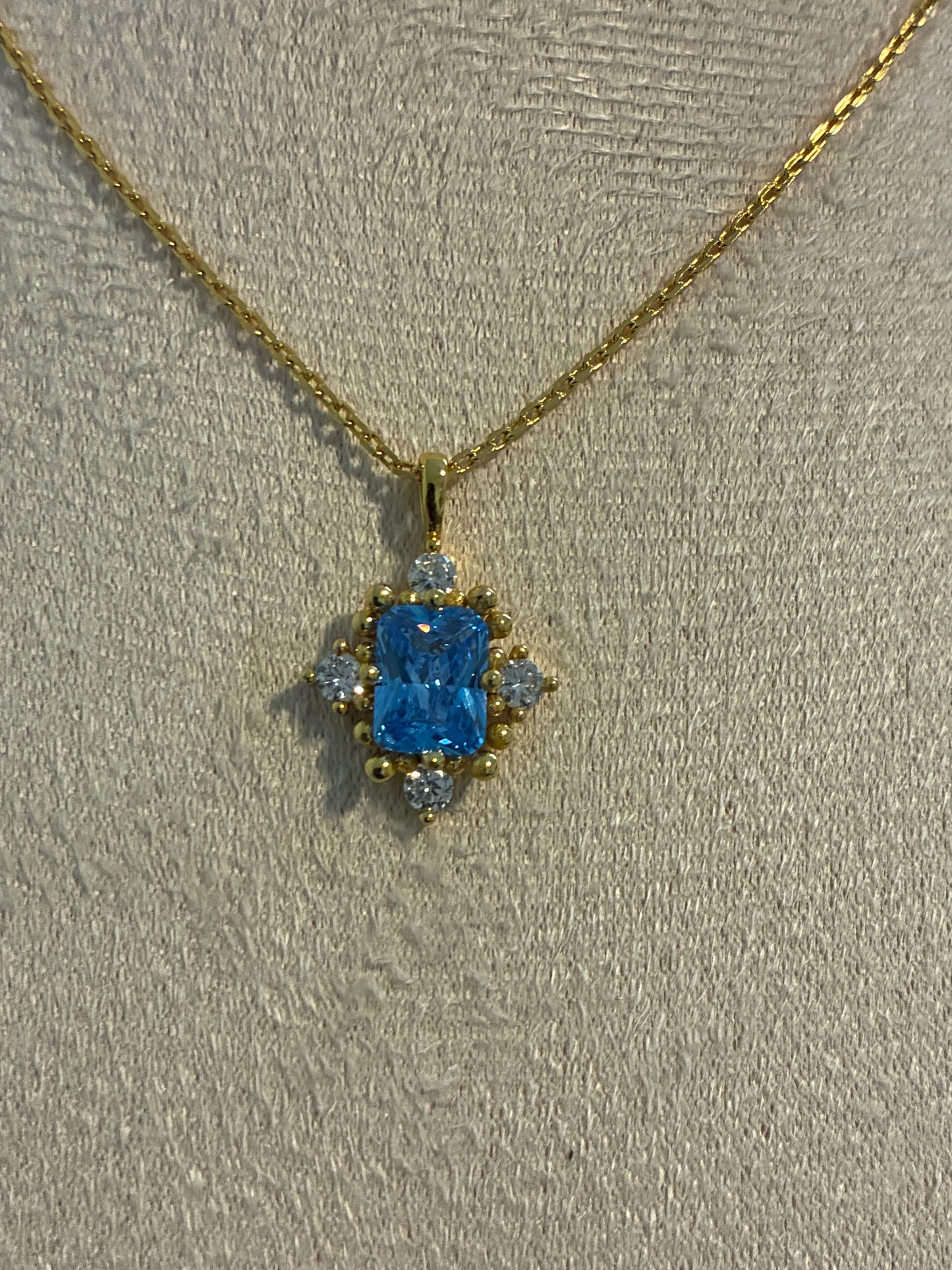 925 Sterling Silver 18k gold plated princess necklace with blue and white zirconia.