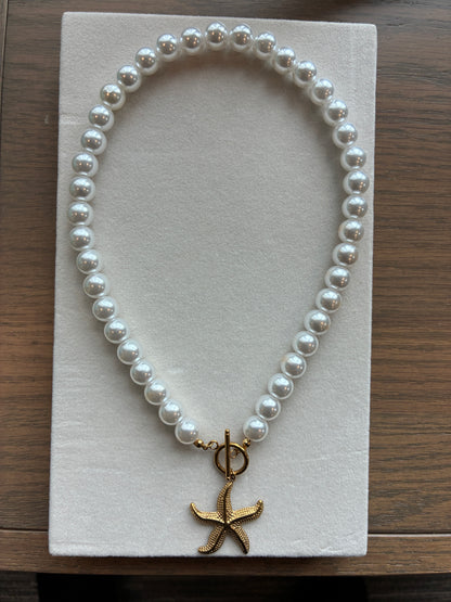 Star fish and pearls necklace and bracelet set.