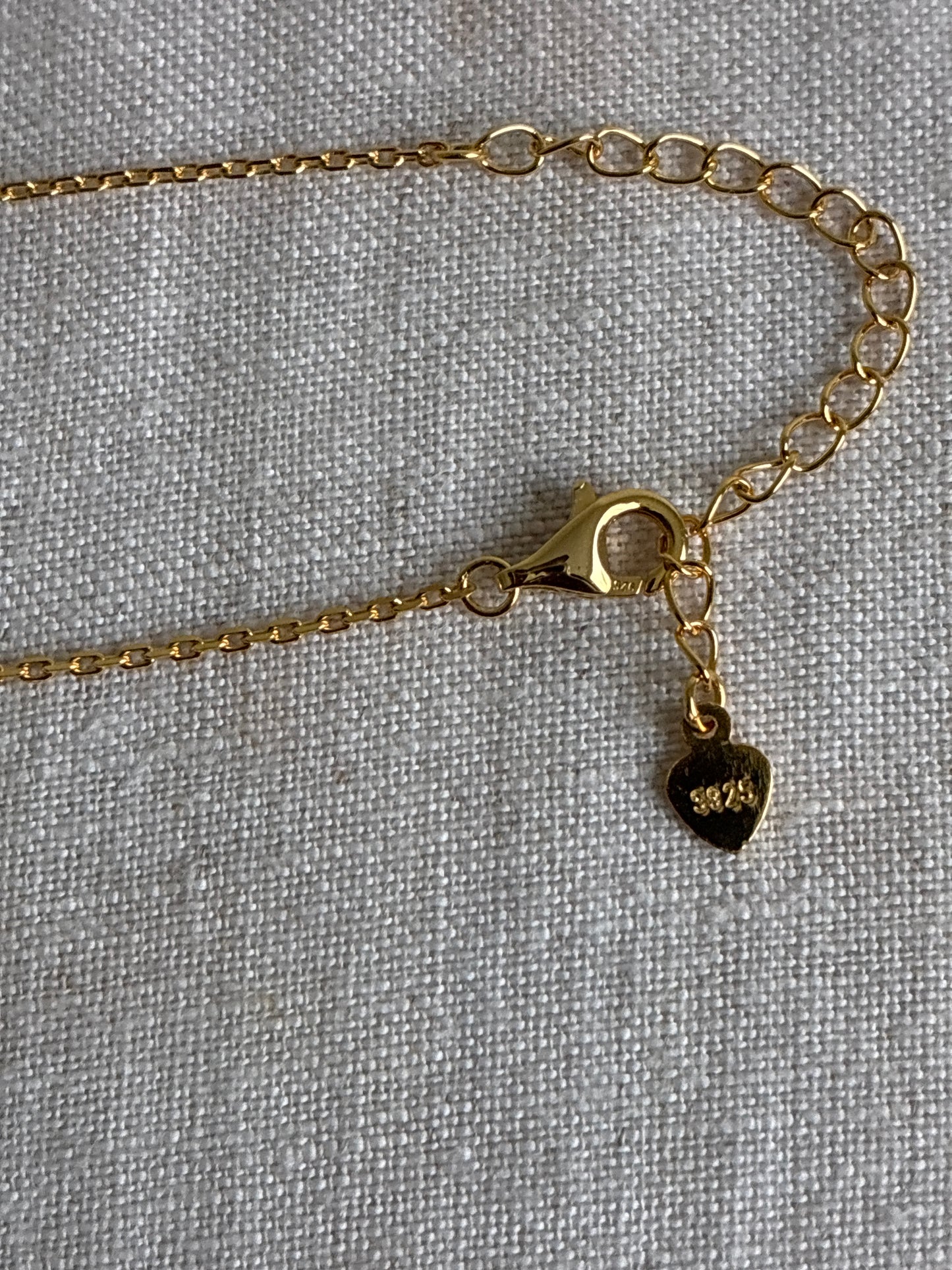 925 Sterling Silver 18k gold plated princess necklace with blue and white zirconia.