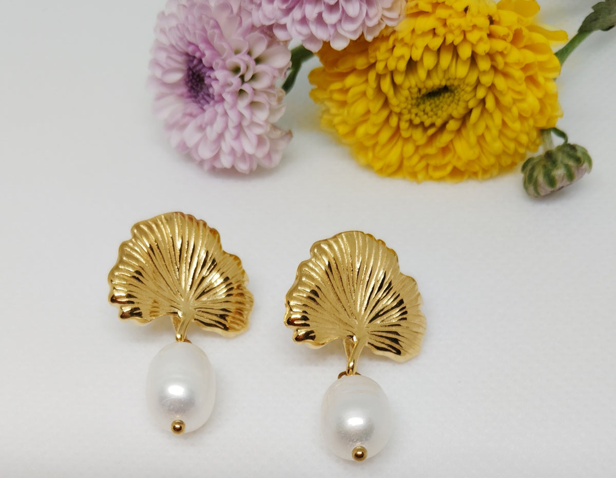 Dainty leaf earrings and necklace set. 18K gold triple plated stainless steel.