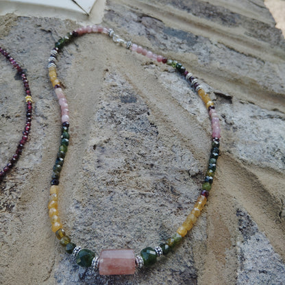 Handcrafted tourmaline necklace with a strawberry quartz and jade center beads. 925 Sterling silver clasp.