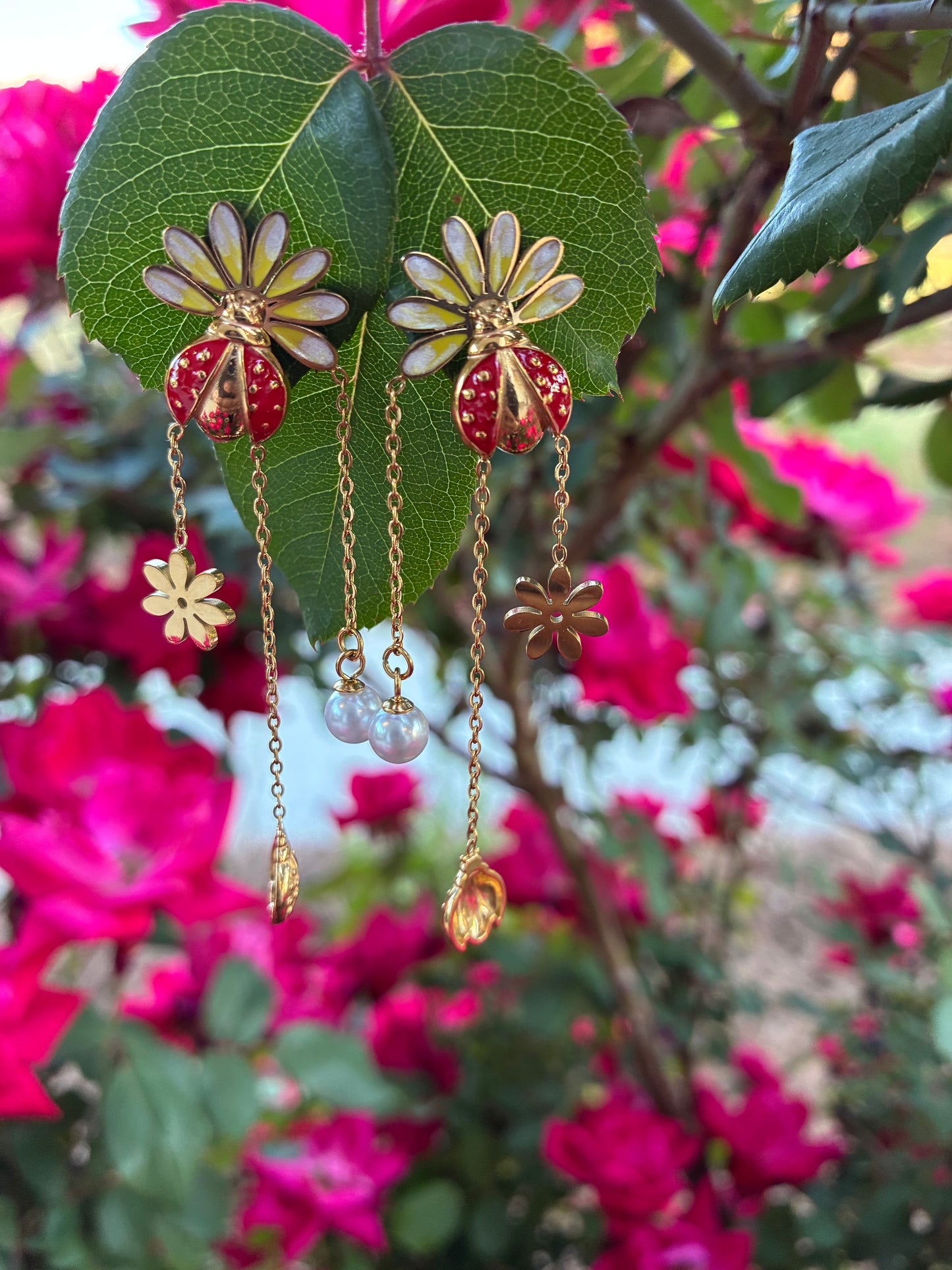 Ladybug and pearl earrings.