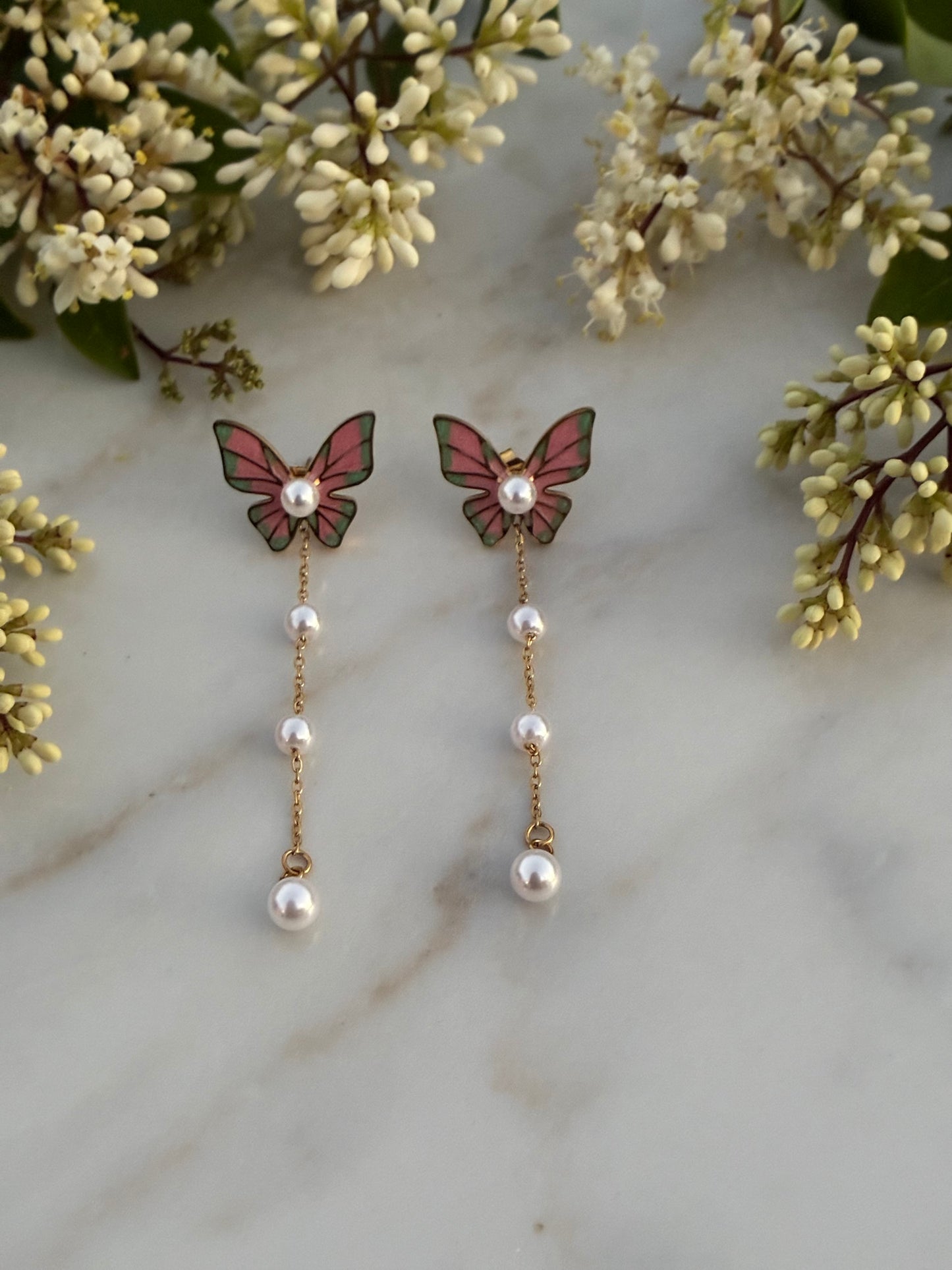 Butterfly and pearl earrings